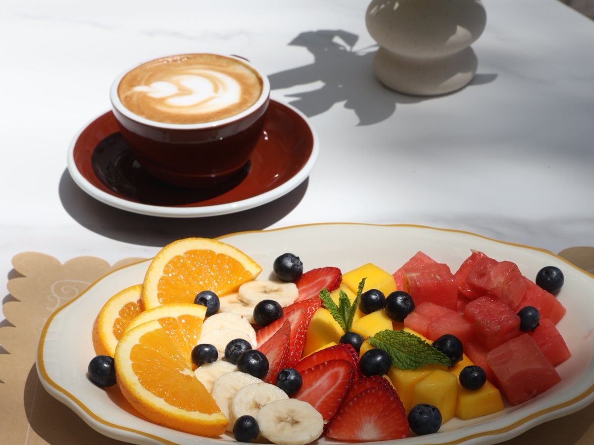 a fresh fruit plate and a cappuccino at Honey’s