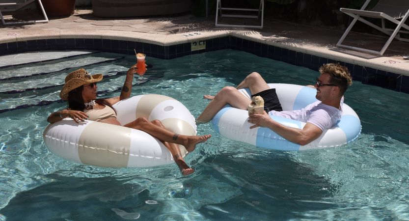 guests relaxing on pool floats